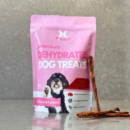 3nHalf Dehydrated Chicken & Pumpkin Dog Treats in pink packaging with treat sticks placed in front of the pink package.